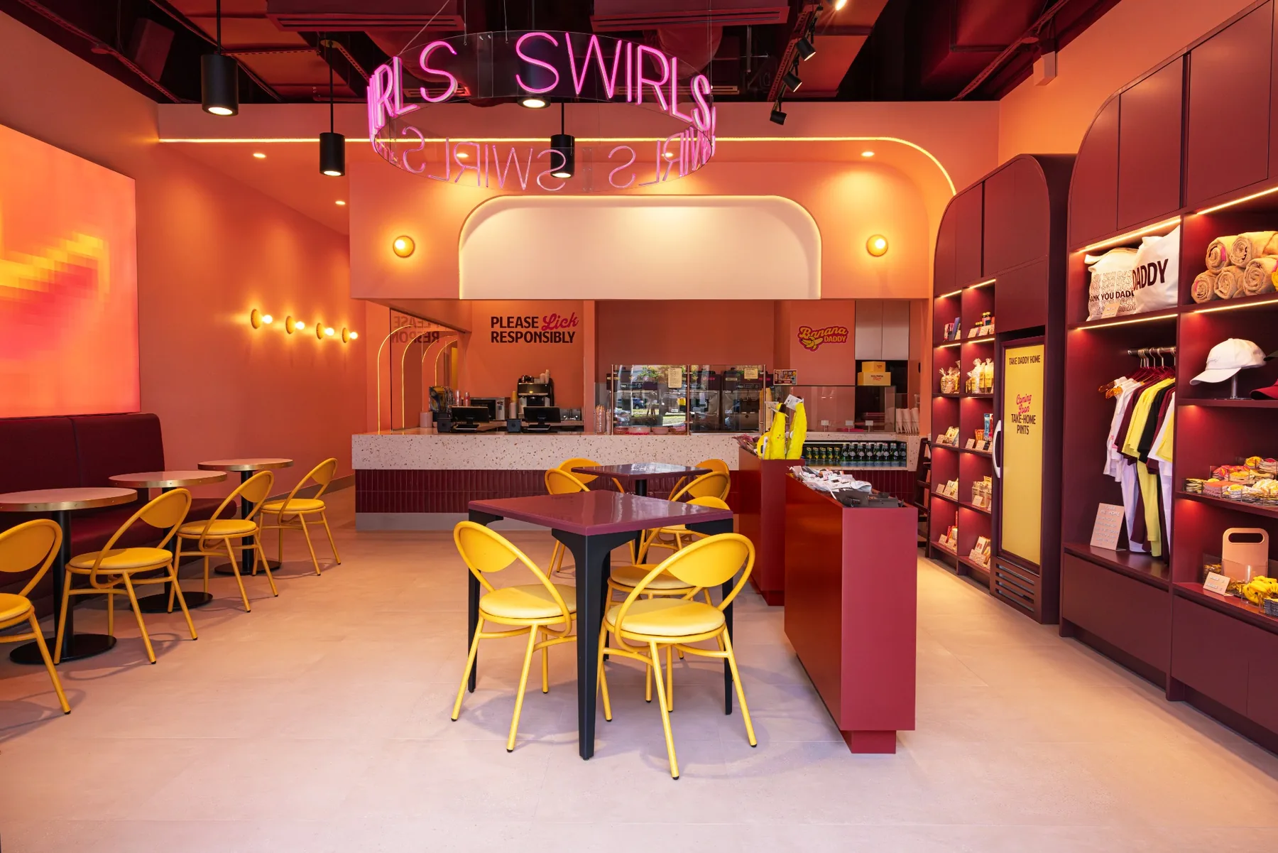 The Banana Daddy soft serve shop in Miami, with its service counter, seating and retail wall.